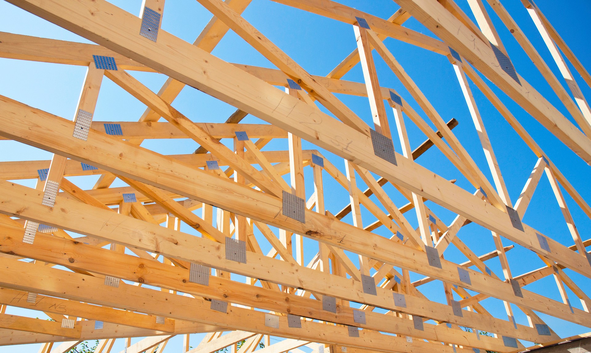 Roofing Construction. Roof Trusses of New Home Building Construction.